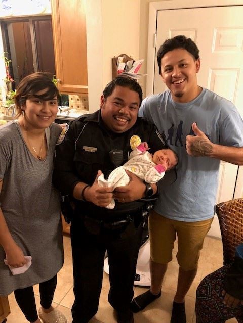 Pictured from left to right: Stephania Quivoga, Officer Jorge Goz, baby Alybree-Dejeus Cerda and Ale